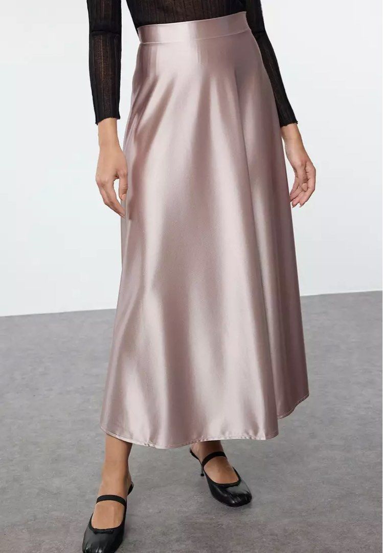 Satin Midi Skirt - Rose Gold (Category: Skirts) located in Quezon City. Submitted by getitrightaway.ph (Listing ID 1462174403, Image 1). Description: -27 waist (I’m 28 and it fits me) -Not the actual when worn photo but similar - Flowy satin midi skirt from Cider - Beautiful rose gold color - High-waisted with a flattering A-line cut - Versatile: dress up or down - Perfect for parties or a night out - Pairs well with heels or sneakers.