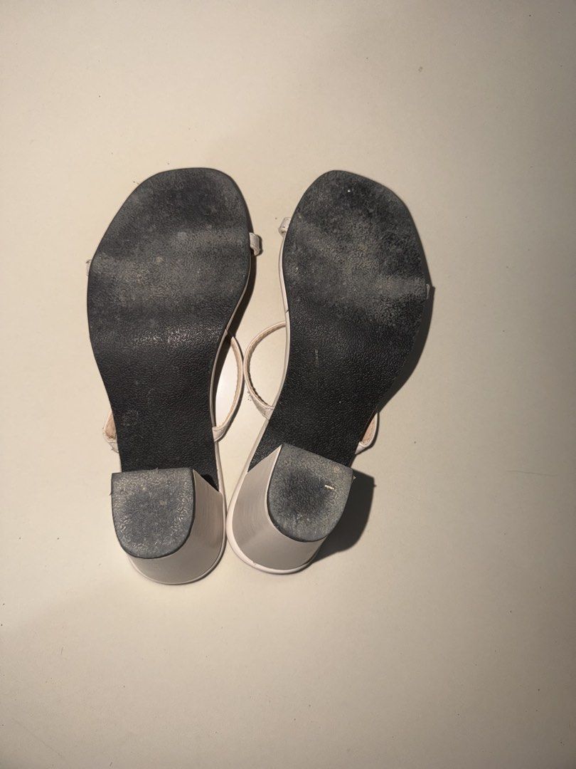 City Walk White Block Heel Sandals (Category: Heels) located in San Jose. Submitted by mbp_123 (Listing ID 1462045330, Image 3). Description: -used once -excess glue on the sides from manufacturer - White block heel sandals from City Walk - Two thin straps across the foot - Open back with a heel strap - Chunky block heel style - Soles show some wear - Brand name printed on insoles.