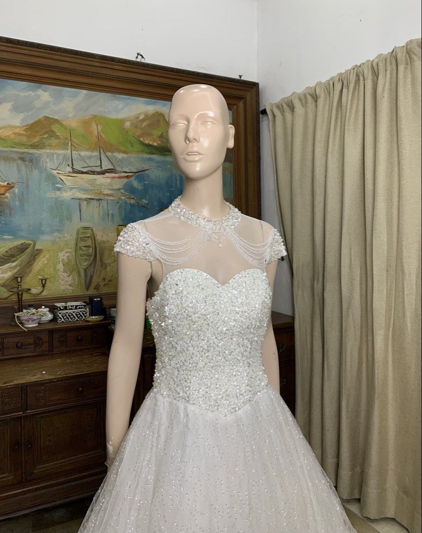 Classic Wedding Gown with intricate beadwork (Category: Evening dresses & gowns) located in General Mariano Alvarez. Submitted by fashionlibraryph (Listing ID 1462145896, Image 3). Description: There is a beautiful richness to this gown, created through the contrast of a densely embellished bodice and a skirt that catches the light with every movement. The fitted bodice is covered in intricate beadwork, giving it a luminous, almost jewelled finis