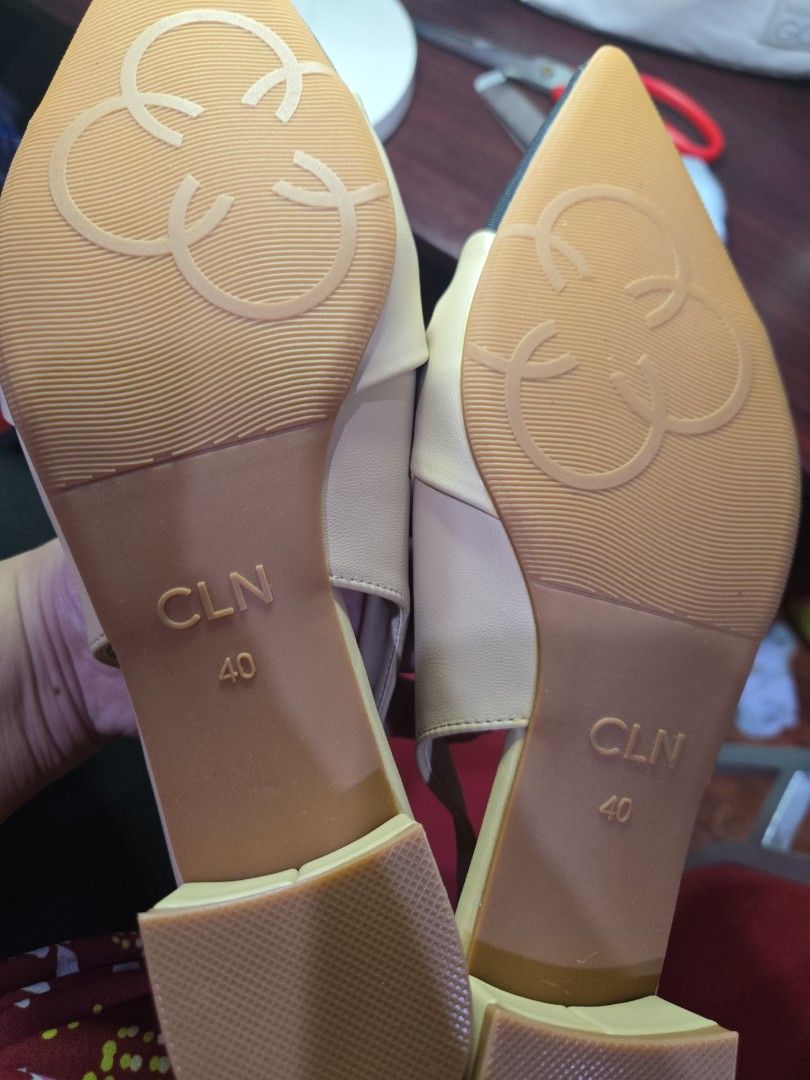 CLN Slingback Pointed Flats (Category: Flats & Sandals) located in Quezon City. Submitted by mello_letgoes (Listing ID 1462176053, Image 2). Description: - Stylish beige slingback flats - Elegant black pointed toe cap - Adorable knot detail on the front - Secure and comfortable elastic strap at the back - Versatile: dress up or down CLN POINTED-TOE BOW SLINGBACK FLATS – SIZE 40 ₱500 – Negotiable Elegant CLN pointed-toe slingback flats with a blac