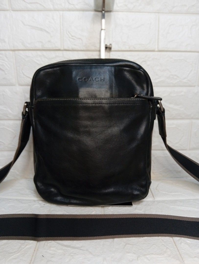 Coach Black Leather Crossbody Bag (Category: Luxury Bags & Wallets) located in Las Pinas. Submitted by etoksi1234 (Listing ID 1462127273, Image 1). Description: Pre-loved Coach leather crossbody bag. Features a front pocket, adjustable strap, and embossed logo. Stylish striped side detail. .