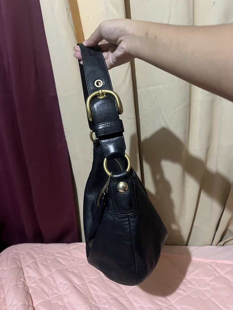 Coach Black Leather Soho Hobo Shoulder Bag (Category: Luxury Bags & Wallets) located in Manila. Submitted by az0r_ (Listing ID 1462062312, Image 2). Description: - Genuine black leather Coach hobo bag - Soft and supple leather with a beautiful drape - Elegant brass hardware - Secure top zipper closure - Spacious interior with zippered pocket and additional compartments - Ideal for everyday use - Serial number clearly visible in photos.