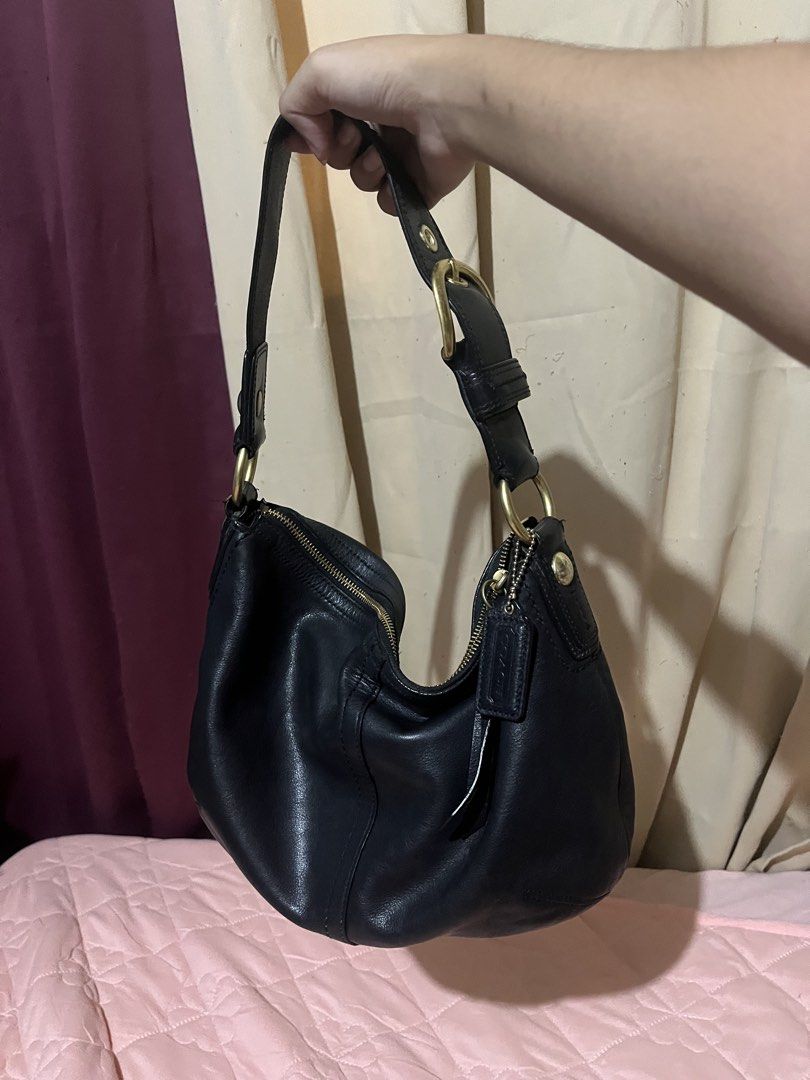 Coach Black Leather Soho Hobo Shoulder Bag (Category: Luxury Bags & Wallets) located in Manila. Submitted by az0r_ (Listing ID 1462062312, Image 1). Description: - Genuine black leather Coach hobo bag - Soft and supple leather with a beautiful drape - Elegant brass hardware - Secure top zipper closure - Spacious interior with zippered pocket and additional compartments - Ideal for everyday use - Serial number clearly visible in photos.