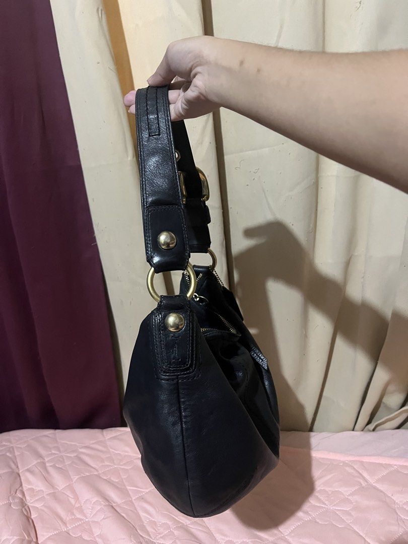 Coach Black Leather Soho Hobo Shoulder Bag (Category: Luxury Bags & Wallets) located in Manila. Submitted by az0r_ (Listing ID 1462062312, Image 3). Description: - Genuine black leather Coach hobo bag - Soft and supple leather with a beautiful drape - Elegant brass hardware - Secure top zipper closure - Spacious interior with zippered pocket and additional compartments - Ideal for everyday use - Serial number clearly visible in photos.