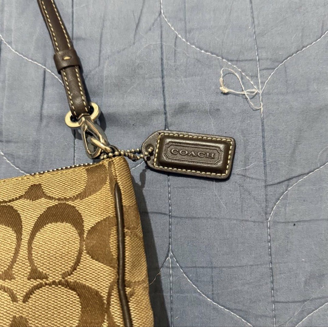 Coach Demi Pochette in Brown (Category: Shoulder Bags) located in Manila. Submitted by diazangeli91556 (Listing ID 1462238056, Image 2). Description: Brown Signature Leather and Canvas Baguette (Sourced from Japan) Hardware: Silver Guaranteed Original Excellent Condition Minimal Used Lalamove or Meet up around Cubao.