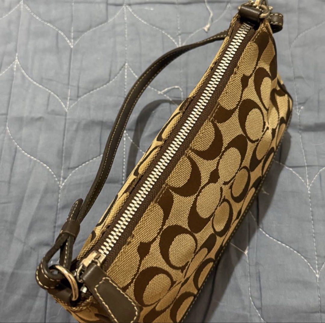 Coach Demi Pochette in Brown (Category: Shoulder Bags) located in Manila. Submitted by diazangeli91556 (Listing ID 1462238056, Image 3). Description: Brown Signature Leather and Canvas Baguette (Sourced from Japan) Hardware: Silver Guaranteed Original Excellent Condition Minimal Used Lalamove or Meet up around Cubao.
