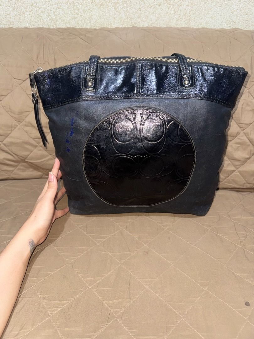 COACH LAURA TOTE (Category: Luxury Bags & Wallets) located in San Pablo. Submitted by calmhawk.60c993 (Listing ID 1462093451, Image 2). Description: a Coach Laura Signature Embossed Leather Tote, which stands out with its circular patent leather panel featuring the iconic embossed "C" signature pattern. this is authentic from canada pasalubong from my sister in law slightly used have minor issue like a blue stain coz my toddler loves to draw alam