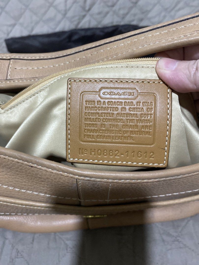 Coach Leather Hobo Bag with Dust Bag (Category: Luxury Bags & Wallets) located in Manila. Submitted by divinemercy_29 (Listing ID 1462132790, Image 3). Description: - Light tan pebbled leather Coach hobo bag - Front pocket with snap closure - Interior zip pocket - Comes with original Coach dust bag - Ideal for everyday use .