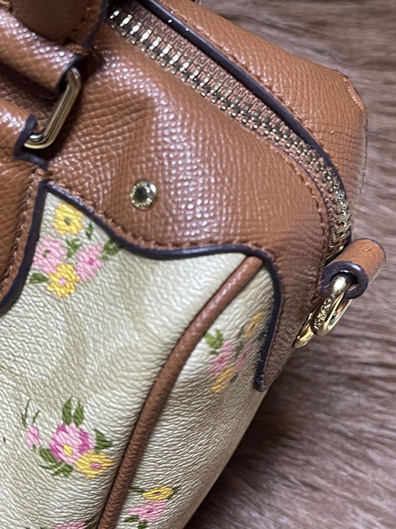 Coach Mini Bennett Satchel (F31777) (Category: Cross-body Bags) located in Imus. Submitted by cheratedfinds (Listing ID 1462128044, Image 3). Description: Coach New York (Original Outlet Line) • Model: Mini Bennett Satchel Crossbody • Style Code: F31777 • Material: Coated Signature Canvas with Crossgrain Leather Trim • Colorway: Light Khaki / Multi Floral / Tan Trim / Gold Hardware • Origin: Made in Vietnam • Inclusions: Detachable & adjustable c