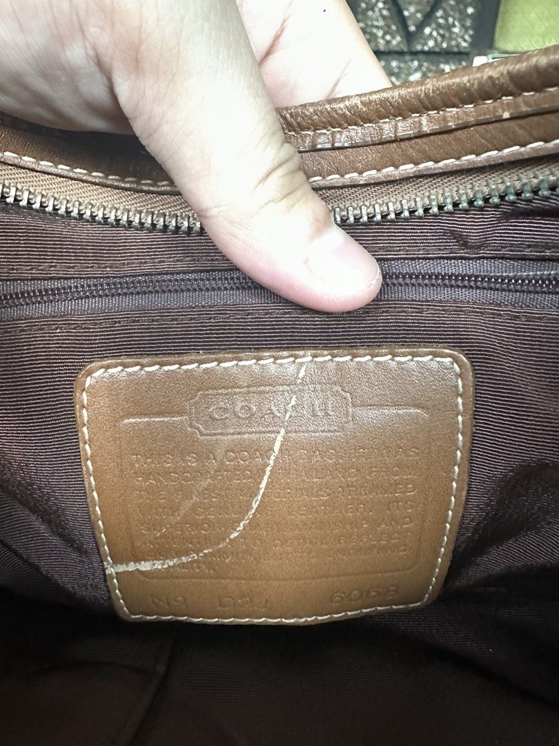 Coach Monogram Canvas Leather Hobo Shoulder Bag (Category: Luxury Bags & Wallets) located in Makati City. Submitted by hehehekdeg (Listing ID 1462137701, Image 3). Description: - Classic Coach khaki hobo bag - Signature monogram canvas with brown leather trim - Adjustable strap with buckle detail - Interior zippered pocket and Coach creed patch - Secure zipper closure - Ideal everyday bag.