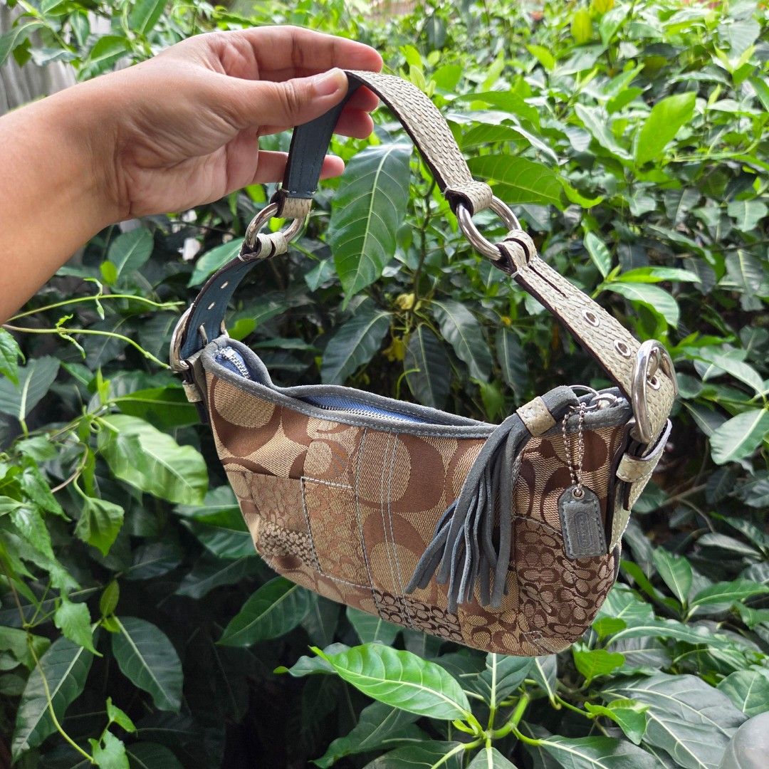 Coach Monogram Python Patchwork Hobo Bag (Category: Luxury Bags & Wallets) located in San Mateo. Submitted by liezelsells (Listing ID 1462067724, Image 1). Description: Guaranteed Authentic. YKK Zipper. Needs Cleaning. Condition: 9/10 Location: San Mateo, Rizal MOP: GCash. NO COD. Couriers: Lalamove, J&T, LBC, JRS. NO Return, Exchange, Refund. .