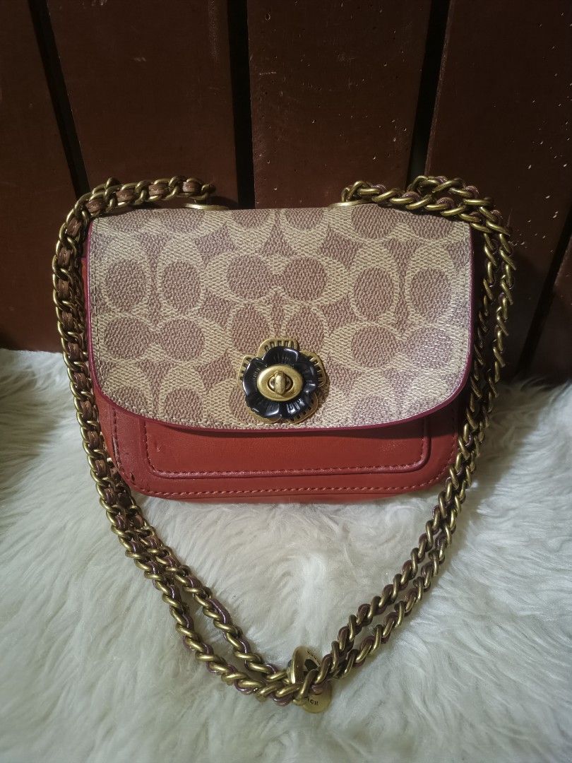 Coach Strawberry Print Wristlet Pouch (Category: Purses & Pouches) located in Cebu City. Submitted by elen30abalo (Listing ID 1462044988, Image 3). Description: Cute Coach wristlet with a fun strawberry print. Tan background with red and green strawberries. Comes with a gold chain strap and a cute giraffe charm. Zipper closure. Great for essentials..
