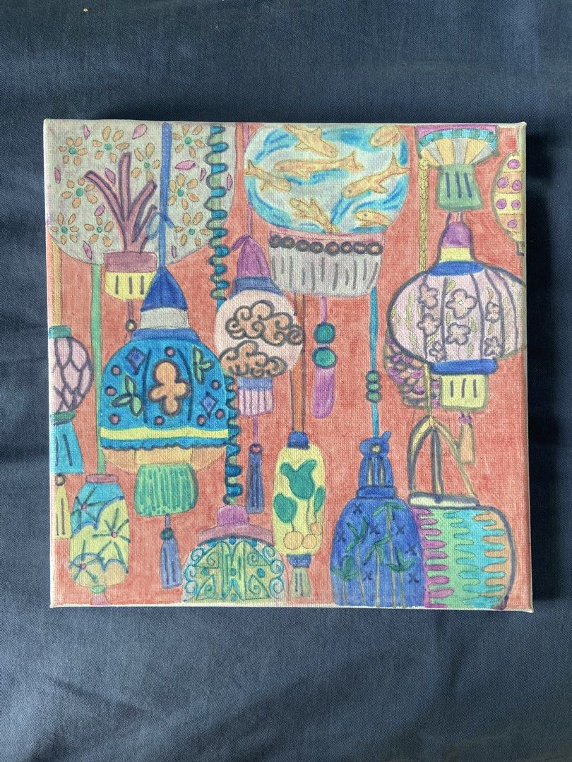Colorful Lantern Painting on Canvas (Category: Art & Prints) located in Mandaluyong City. Submitted by coolmami (Listing ID 1462069257, Image 1). Description: - Hand-painted canvas art - Features vibrant, colorful lanterns - Includes designs like fish in a bowl and floral patterns - Warm coral background - Ready to hang - Perfect for adding a pop of color to your home decor.