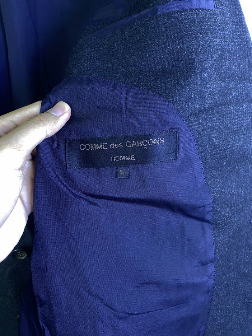 Comme des Garçons Homme Blazer Jacket (Category: Coats, Jackets and Outerwear) located in Manila. Submitted by declutterpromax (Listing ID 1462079947, Image 2). Description: - Dark grey blazer from Comme des Garçons Homme - Classic single-button closure - Fully lined interior - Versatile for smart casual or formal outfits.