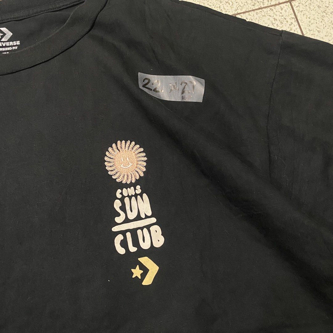 Converse Oversized Fit "Sun Club" Graphic Tee (Category: Tshirts & Polo Shirts ) located in Manila. Submitted by sepamorash53558 (Listing ID 1462081166, Image 2). Description: - Brand: Converse - Style: Oversized T-shirt - Graphic: "Sun Club" on front, large beach theme on back - Material: 100% Cotton - Sizing: Tagged US-S, Euro-S, Asia-M - Look: Casual, relaxed.
