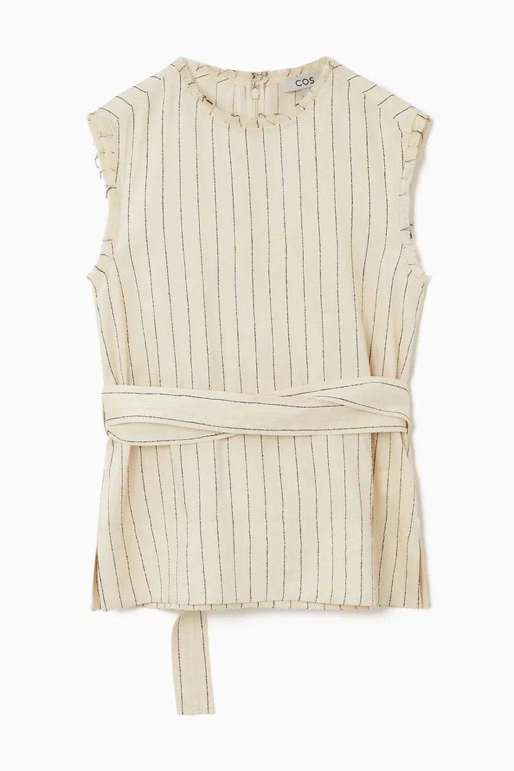 COS Striped Sleeveless Belted Top (Category: Sleeveless) located in Pasig City. Submitted by lexnthecity (Listing ID 1462100577, Image 2). Description: - COS sleeveless top - Cream and black stripes - Tie belt detail at the waist - Raw edge detail on sleeves - Used once.