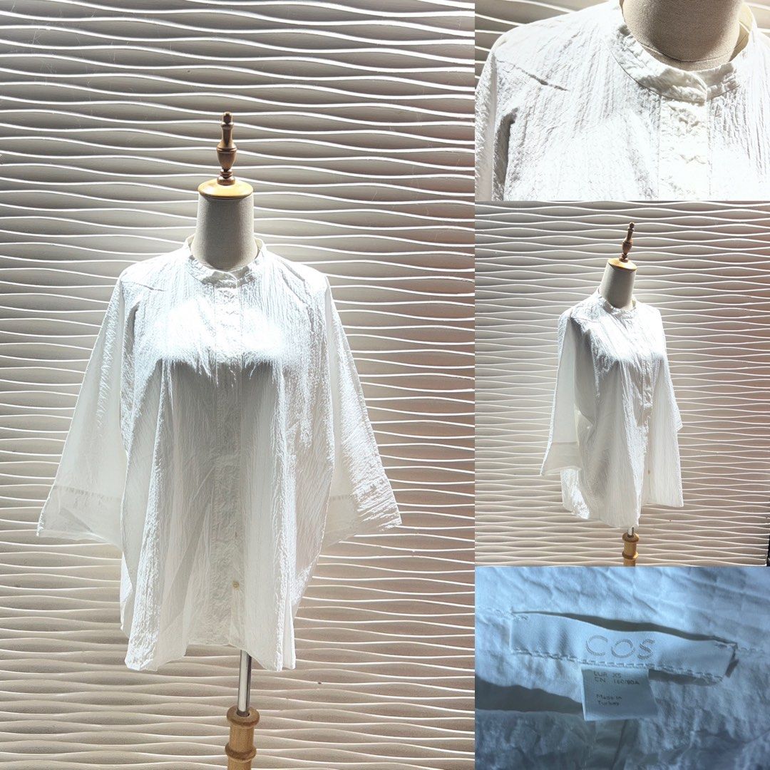 COS White Textured Mandarin Collar Button Up Shirt (Category: Longsleeves) located in Bacolod City. Submitted by bhabissagal-05763 (Listing ID 1462191673, Image 1). Description: - White COS shirt - Textured fabric - Mandarin collar - Button-up front - Relaxed fit with wide sleeves - Versatile for casual and smart-casual outfits.