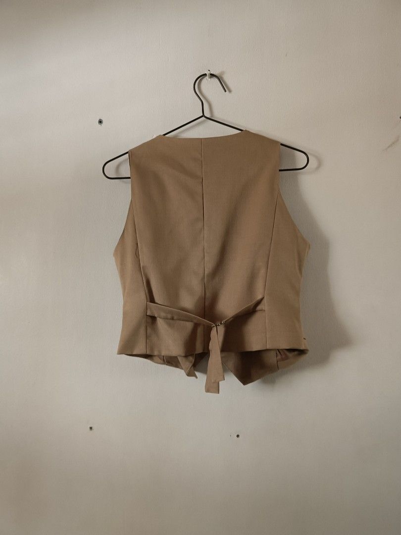Cotton Candy Tan Button-Up Vest (Category: Sleeveless) located in Manila. Submitted by shajanina.14 (Listing ID 1462127833, Image 3). Description: Cotton Candy Original Preloved As good as new As per measuring tape, Bust- up to 36 inches Waist- up to 30 inches Length- 18 inches.