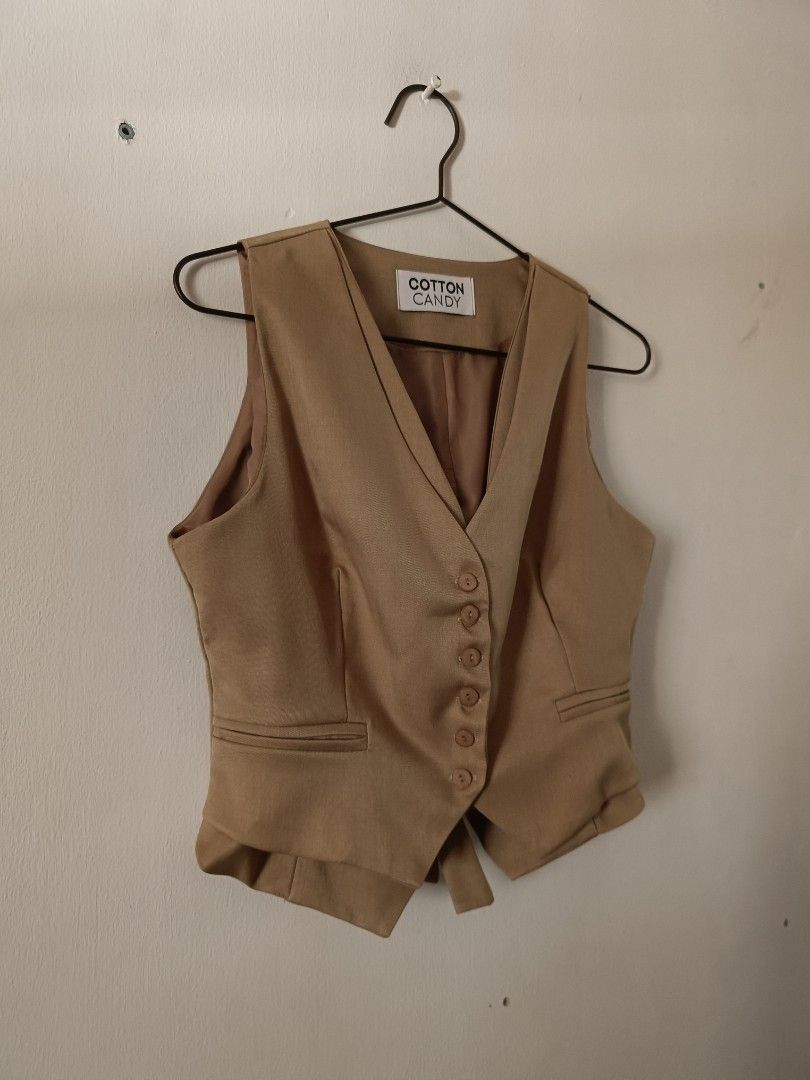 Cotton Candy Tan Button-Up Vest (Category: Sleeveless) located in Manila. Submitted by shajanina.14 (Listing ID 1462127833, Image 2). Description: Cotton Candy Original Preloved As good as new As per measuring tape, Bust- up to 36 inches Waist- up to 30 inches Length- 18 inches.