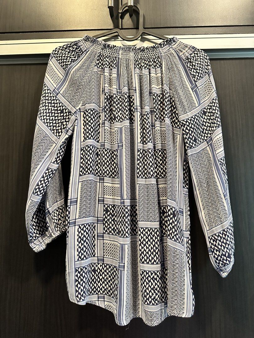 Cotton On Boho Beach Tassel Neck Blouse (Category: Blouses) located in Manila. Submitted by cnik8 (Listing ID 1462112024, Image 2). Description: - Cotton On blouse with a cool blue and white geometric print. - Smocked neckline with a tassel tie for a stylish detail. - Comfortable 3/4 sleeves with elastic cuffs. .