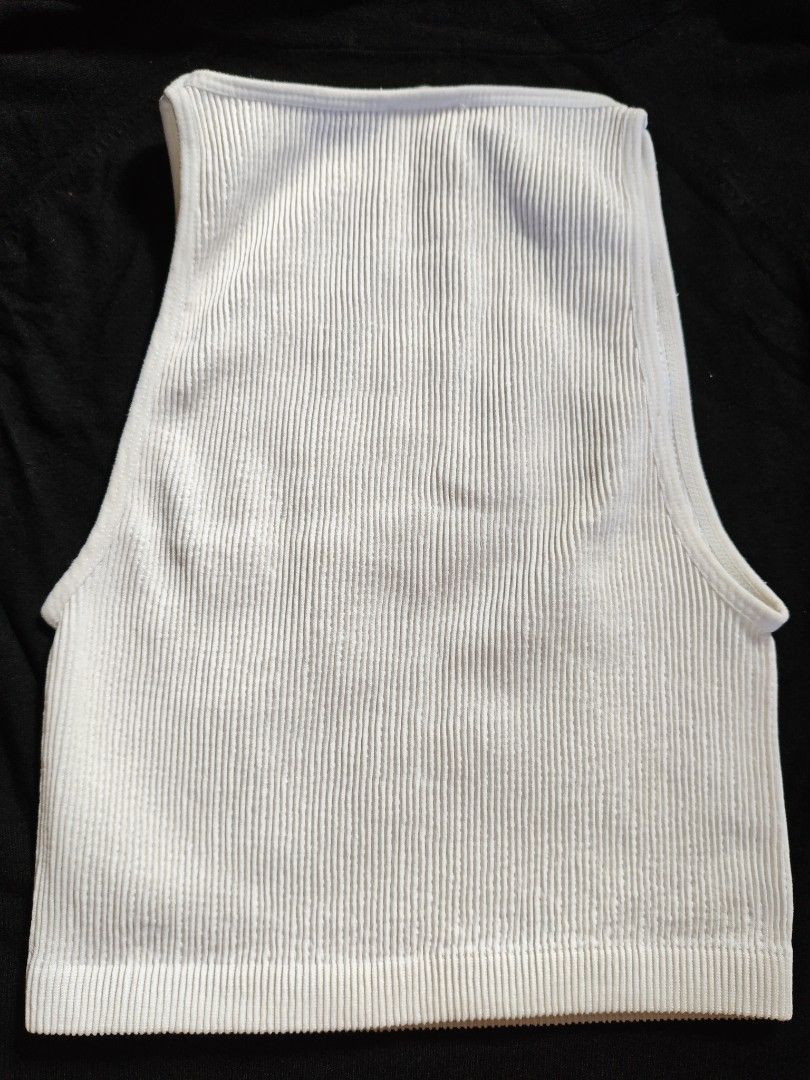 Cotton On Ribbed Tank Tops (Category: Sleeveless) located in Paranaque City. Submitted by anonymoosh (Listing ID 1462049494, Image 3). Description: Set of 2 ribbed tank tops: black (square neck, thick straps) and white (high neck, wide straps). Both cropped. Perfect wardrobe basics for layering or wearing solo. Take all for 500.