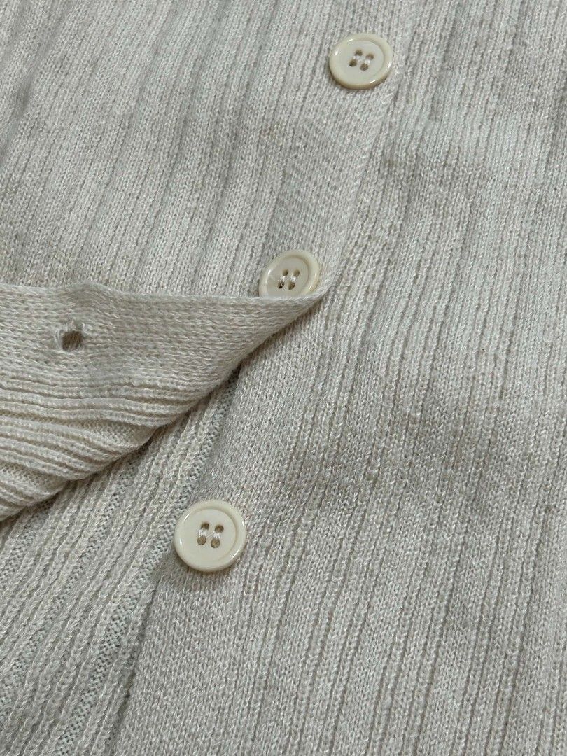 Cream Ribbed Off-Shoulder Button-Up Cardigan (Category: Coats, Jackets and Outerwear) located in Dasmarinas. Submitted by closetofamadwoman (Listing ID 1462117473, Image 3). Description: Feel free to DM for more pics and details! Size: Fits S-M MOP: GCash or Bank Transfer (No COD) Delivery: J&T Express.
