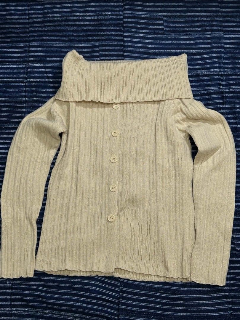 Cream Ribbed Off-Shoulder Button-Up Cardigan (Category: Coats, Jackets and Outerwear) located in Dasmarinas. Submitted by closetofamadwoman (Listing ID 1462117473, Image 1). Description: Feel free to DM for more pics and details! Size: Fits S-M MOP: GCash or Bank Transfer (No COD) Delivery: J&T Express.