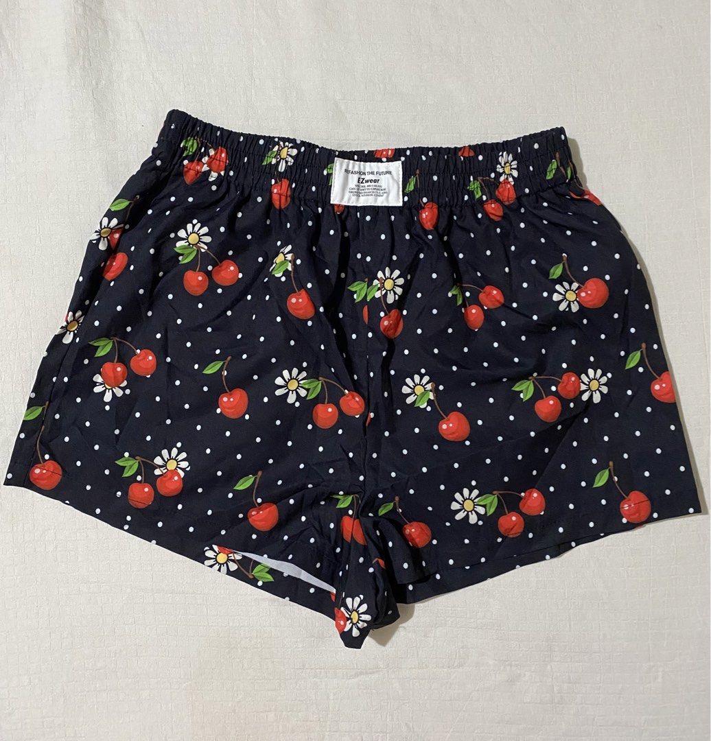 Cherry & Polka Dot Boxer Shorts (Category: Shorts) located in Quezon City. Submitted by getitrightaway.ph (Listing ID 1462176190, Image 3). Description: - Cute dark blue boxer shorts - All-over print: red cherries, white polka dots, and white flowers - Comfortable elastic waistband - Ideal for lounging or sleeping - Fun and playful design.