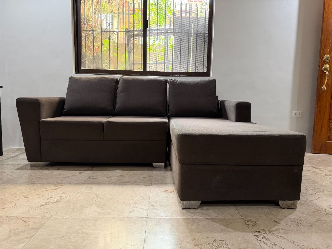 Dark Brown L-Shape Sectional Sofa Bed / Chaise Lounge - Great Condition (Category: Sofas) located in Makati City. Submitted by pinkytgo (Listing ID 1462039334, Image 2). Description: Selling a highly comfortable and space-saving L-shaped sectional couch with a right-facing chaise lounge. Perfect for cozy living rooms, condo units, or entertainment spaces! Color: Dark Brown / Espresso Brown Material: Premium, durable woven fabric upholstery with m