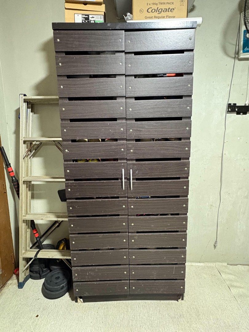Dark Brown Shoes Cabinet with Spacious Storage (Category: Shelves, Cabinets & Racks) located in Quezon City. Submitted by zealfox-17 (Listing ID 1462072367, Image 3). Description: - Move out sale! - Dark brown shoe cabinet - Plenty of storage space - Sturdy and durable construction - Perfect for home organization - Dimensions: Approx. 65 inches (H) x 24 inches (W) - Price: Php 5,600 - Don't miss out on this great deal!.