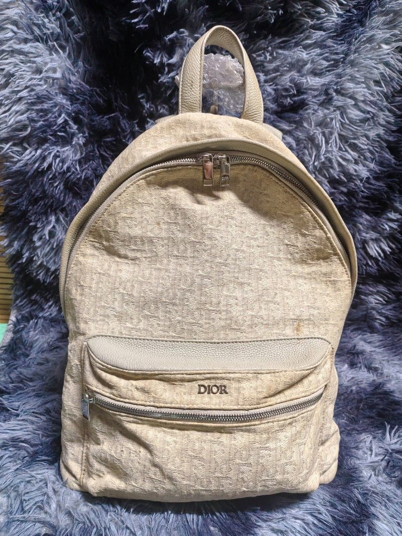 Dior monogram backpack (Category: Luxury Bags & Wallets) located in Iloilo. Submitted by luxury.ilo1984 (Listing ID 1462184430, Image 1). Description: Thrifted Ukay Source Rank AB with minimal flaws sign of use only mayron Lang po mga dumi sa body nya kayo nalang po mag bahala mag linis Washeable naman po canvas materials po ito over all Excellent to Pristine condition Size large po ito Dimes 14 by 16 Made in italy Unisex po ito ung kulay nya par