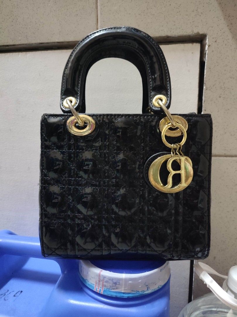 Dior Patent Lady Dior Mini Bag Black (Category: Cross-body Bags) located in Pasig City. Submitted by xcess_baggage (Listing ID 1462054315, Image 1). Description: -Dior Lady Dior bag - Mini size - Black patent leather - Gold hardware with 'Dior' charm - Iconic quilted pattern - Top handle - Immaculate interior condition - Ideal for evening wear or elevating any outfit.