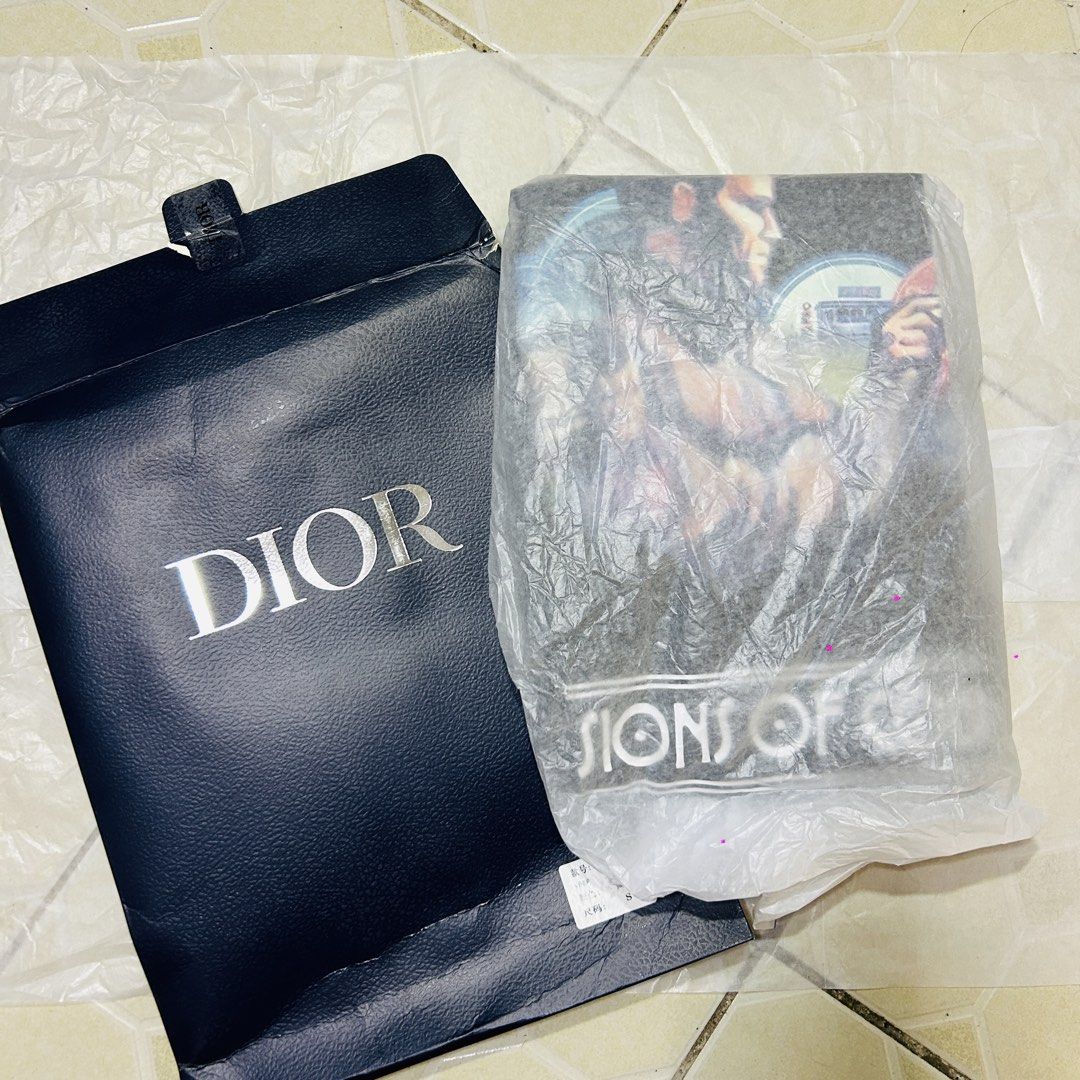 Dior shirt with box (Category: Luxury Apparel) located in Baguio. Submitted by kckc_luxury (Listing ID 1462198997, Image 2). Description: 🌸 TINY PINK SPOTS ARE LENS DAMAGE, NOT CLOTH STAINS ————————— ❗️KINDLY READ BEFORE MAKING AN OFFER❗️ LISTING DETAILS size:Large width x length (inches):22x30 condition: EXCELLENT --- MOP: Gcash / BPI MOD: J&T / JRS LOCATION: Baguio City --- NOTE: • Manage your expectations • Photos did not go under any edit bu