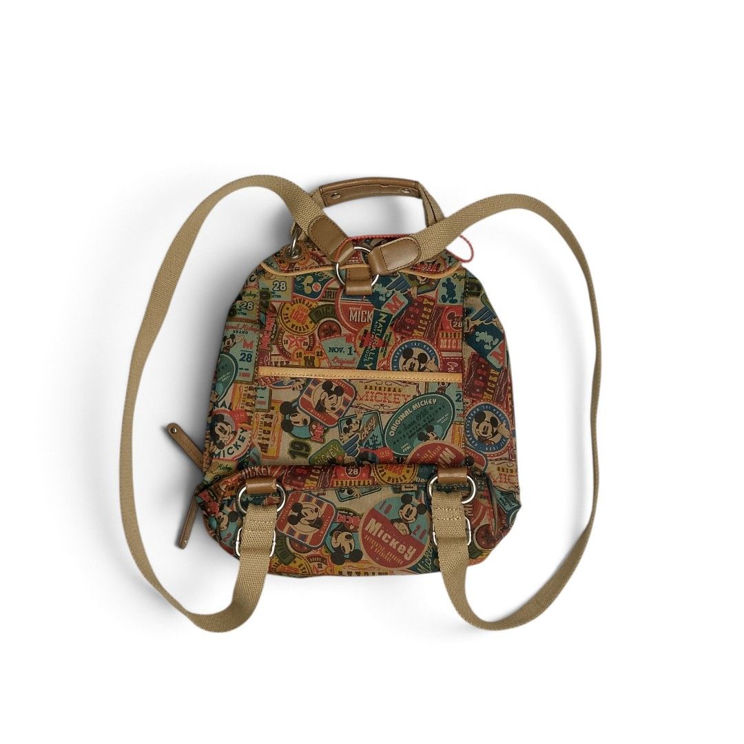 Disney Mickey Mouse Vintage Print Backpack (Category: Backpacks) located in Dasmarinas. Submitted by johnkho (Listing ID 1462129321, Image 2). Description: - Adorable Disney backpack featuring a vintage Mickey Mouse print all over. - Tan straps and handle for a classic look. - Interior lining also boasts a fun Mickey Mouse pattern. - Secure zip closure to keep your belongings safe. - Perfect for daily use, school, or a fun getaway..