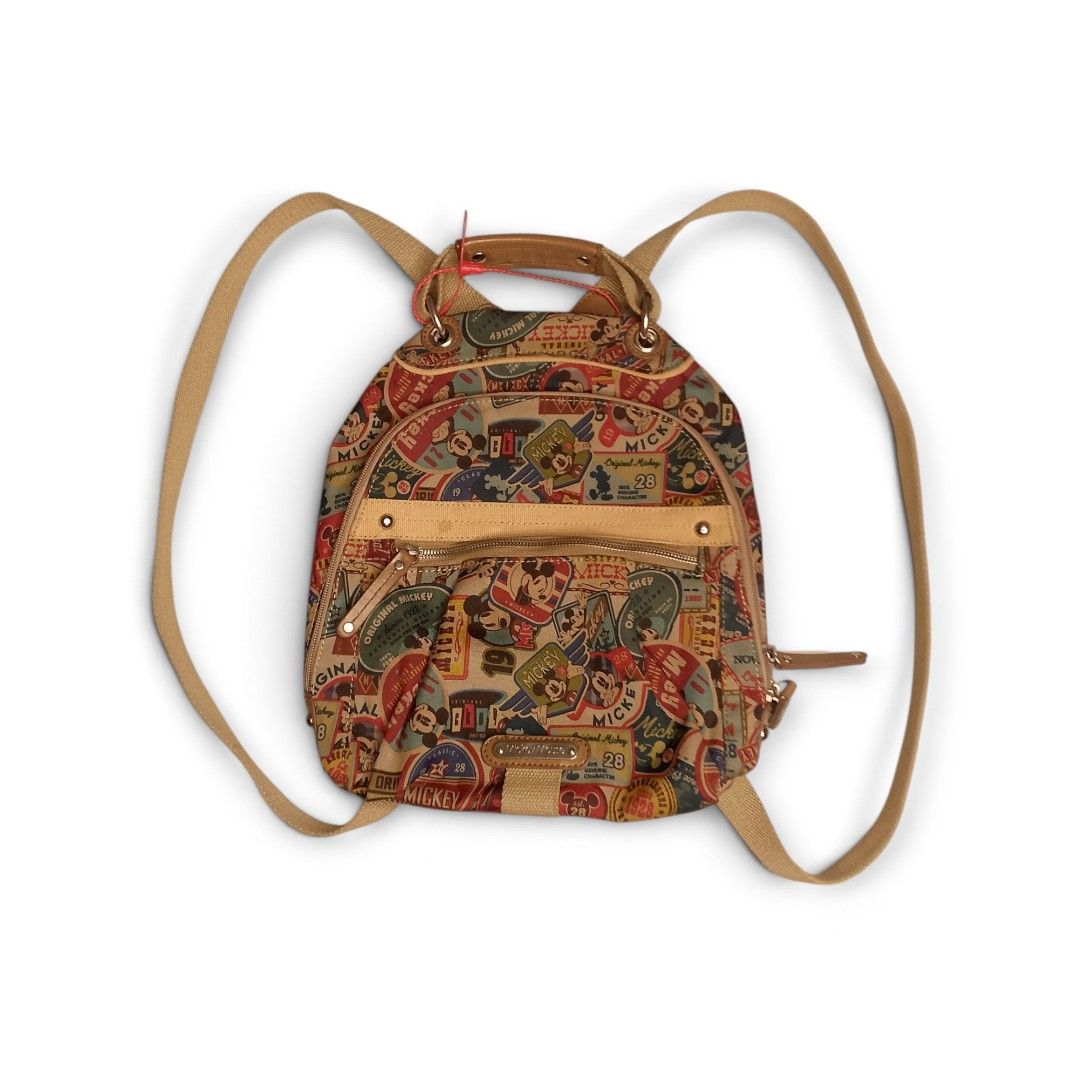 Disney Mickey Mouse Vintage Print Backpack (Category: Backpacks) located in Dasmarinas. Submitted by johnkho (Listing ID 1462129321, Image 1). Description: - Adorable Disney backpack featuring a vintage Mickey Mouse print all over. - Tan straps and handle for a classic look. - Interior lining also boasts a fun Mickey Mouse pattern. - Secure zip closure to keep your belongings safe. - Perfect for daily use, school, or a fun getaway..