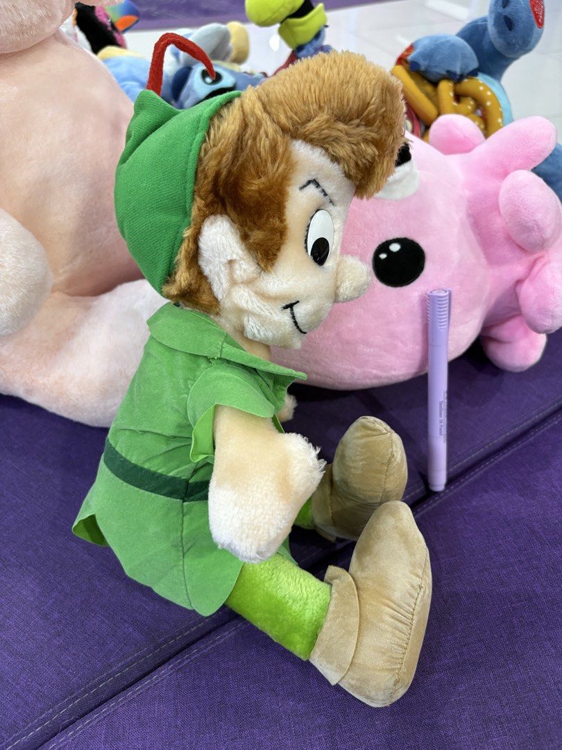 Disney Peter Pan Plush Toy (Category: Plushies & Soft Toys) located in Taguig. Submitted by goofysofties (Listing ID 1462113609, Image 3). Description: - Adorable Peter Pan plush toy - Features classic green tunic and tights - Soft and cuddly material - Ideal for Disney fans and collectors - Ready to find a new home!.
