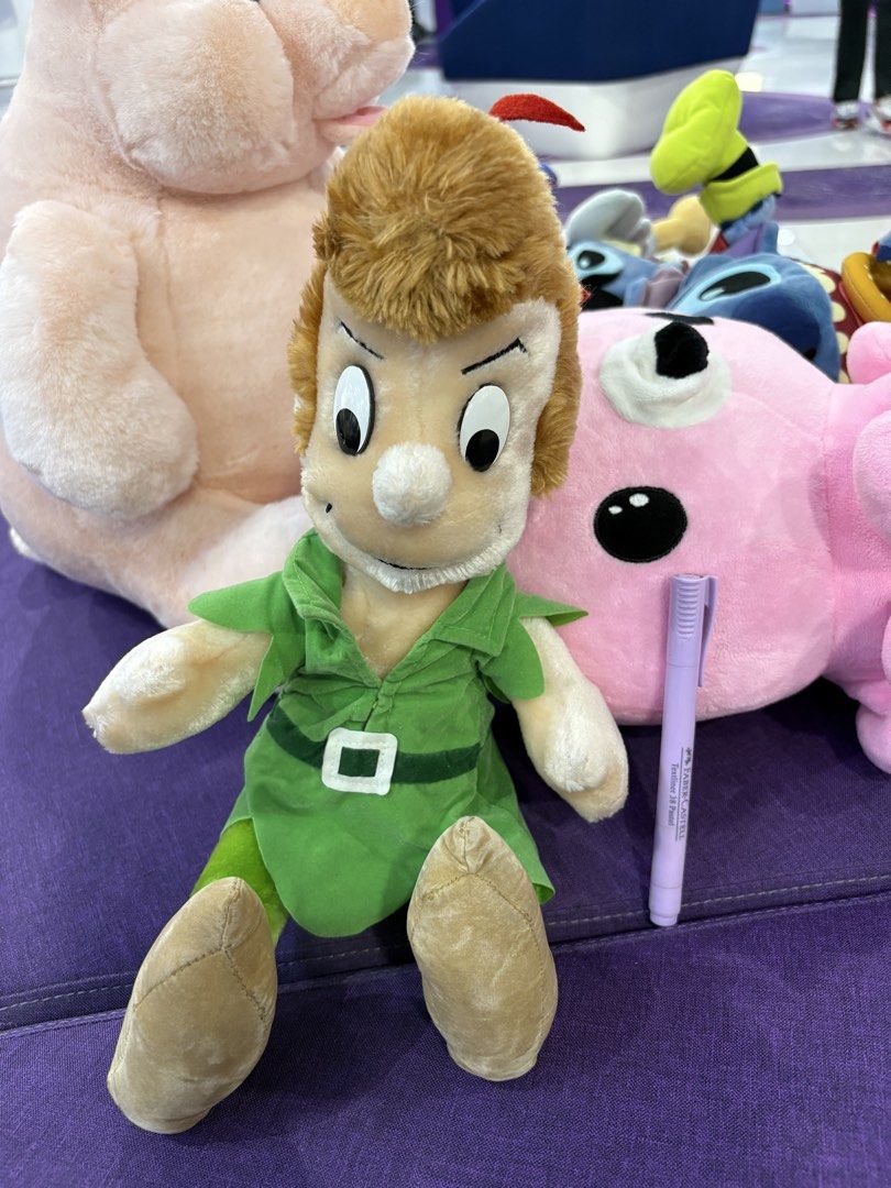 Disney Peter Pan Plush Toy (Category: Plushies & Soft Toys) located in Taguig. Submitted by goofysofties (Listing ID 1462113609, Image 1). Description: - Adorable Peter Pan plush toy - Features classic green tunic and tights - Soft and cuddly material - Ideal for Disney fans and collectors - Ready to find a new home!.