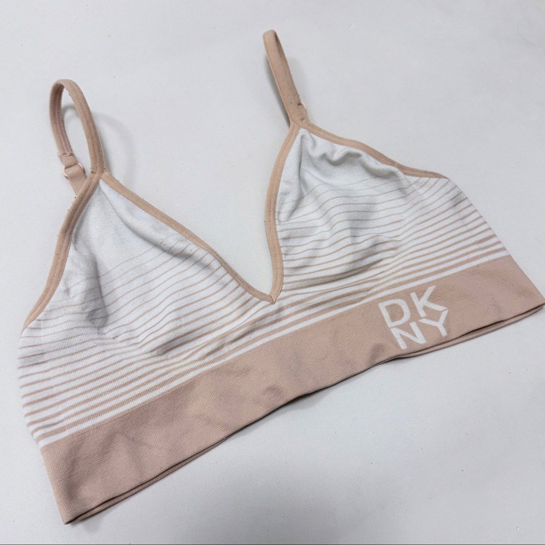 DKNY Beige & White Stripes Seamless Bralette [M] (Category: Undergarments & Loungewear) located in Malabon City. Submitted by k_intimates (Listing ID 1462243343, Image 2). Description: Details: • Size M / no pads included • Very light transfer stain (barely noticeable) • DKNY seamless bralette with beige and white stripes and a signature logo band..