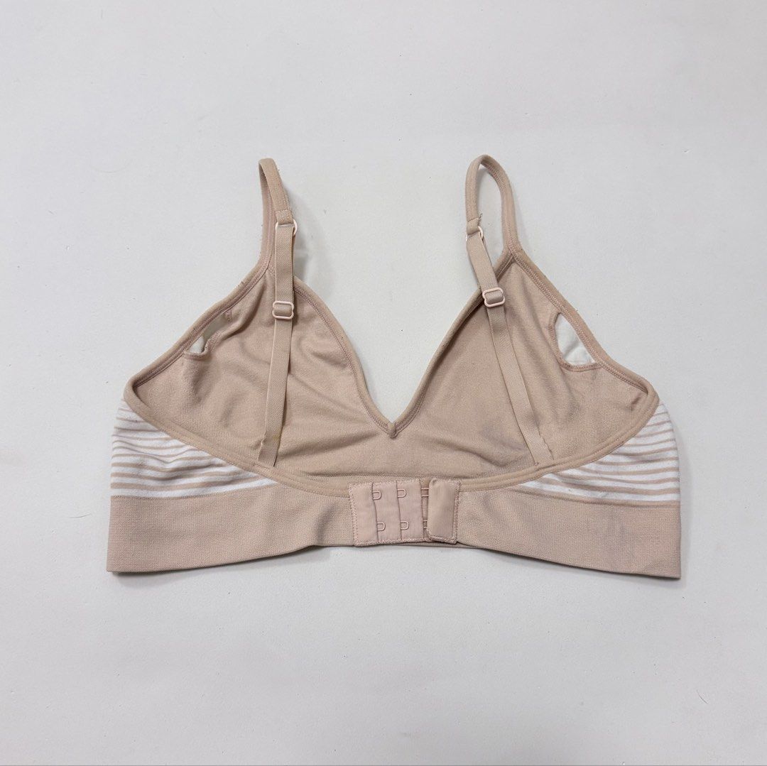 DKNY Beige & White Stripes Seamless Bralette [M] (Category: Undergarments & Loungewear) located in Malabon City. Submitted by k_intimates (Listing ID 1462243343, Image 3). Description: Details: • Size M / no pads included • Very light transfer stain (barely noticeable) • DKNY seamless bralette with beige and white stripes and a signature logo band..