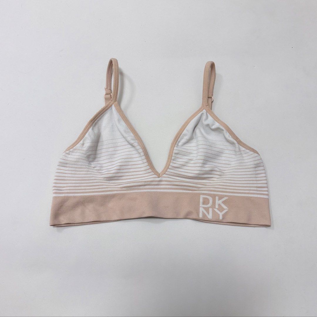 DKNY Beige & White Stripes Seamless Bralette [M] (Category: Undergarments & Loungewear) located in Malabon City. Submitted by k_intimates (Listing ID 1462243343, Image 1). Description: Details: • Size M / no pads included • Very light transfer stain (barely noticeable) • DKNY seamless bralette with beige and white stripes and a signature logo band..