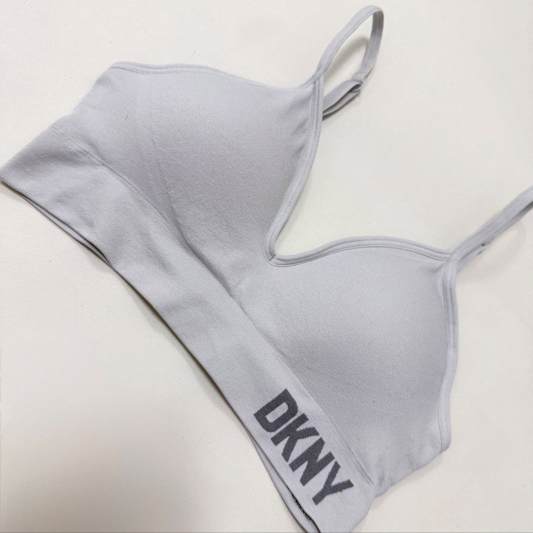 DKNY Light Grey Seamless Bralette [S] (Category: Undergarments & Loungewear) located in Malabon City. Submitted by kmby_ (Listing ID 1462209116, Image 2). Description: Details: • Size Small / padded • Like new (has washable dirt only, but will wash it before I sent out) • Light grey DKNY seamless bralette featuring adjustable straps and the brand logo on the ribbed underband..