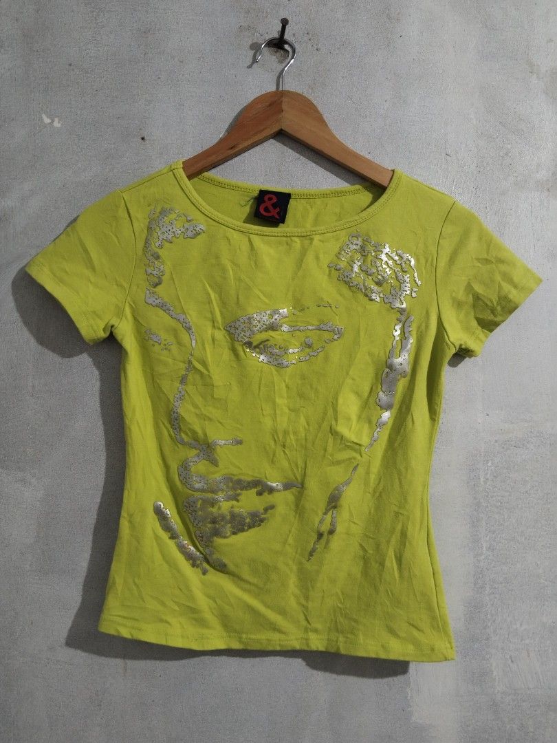 Dolce & Gabbana & Ampersand Graphic Tee (Category: Shirts) located in Tabaco. Submitted by skycat_29 (Listing ID 1462183621, Image 1). Description: - Eye-catching lime green t-shirt - Features a unique silver graphic print of a face - Classic short sleeves and crew neck design - Proudly made in Italy - Ideal for casual and everyday wear.