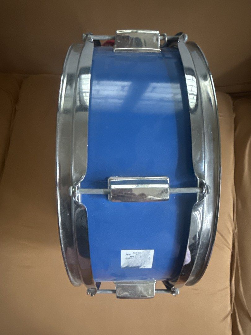 DRM Drums Blue Snare Drum with Strap (Category: Musical Instruments) located in Paranaque City. Submitted by goldboxph (Listing ID 1462067657, Image 1). Description: - Blue snare drum from DRM Drums - White drum head featuring the brand logo - Comes with a red strap - Ideal for both practice sessions and live performances - Ready for its next owner!.