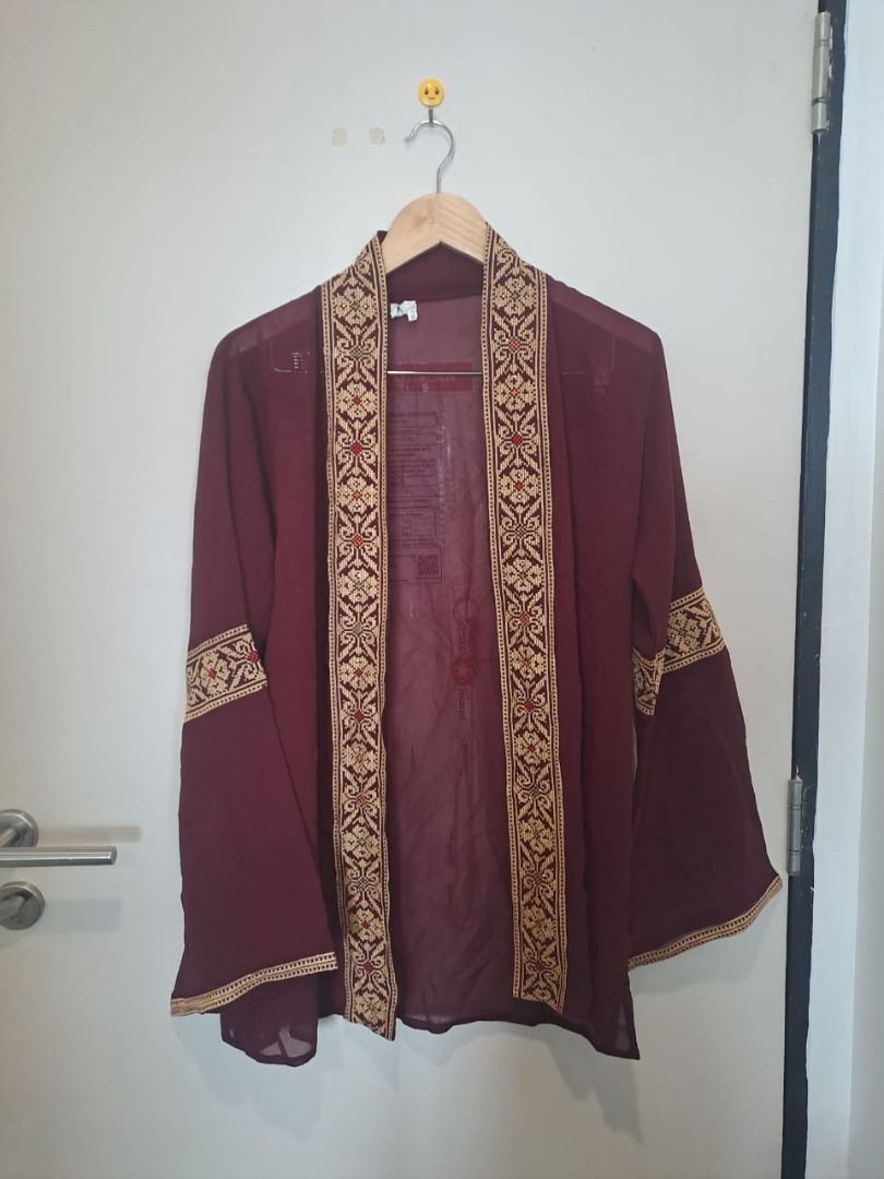 elegant cover up (Category: Coats, Jackets and Outerwear) located in Mandaluyong City. Submitted by epicowl-c93c (Listing ID 1462222702, Image 1). Description: The image shows a maroon sheer kimono-style cardigan with intricate, geometric woven or embroidered borders along the open front panel, hem, and mid-sleeves. It features lightweight, translucent georgette or chiffon fabric and dramatic bell sleeves..