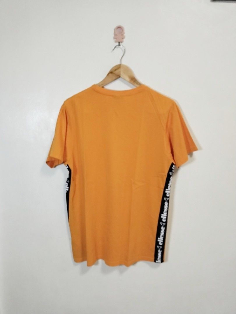Ellesse sidetape shirt (Category: Tshirts & Polo Shirts ) located in Pateros City. Submitted by blashjunks.y2k (Listing ID 1462147763, Image 2). Description: ELLESSE SIDETAPE SHIRT SIZE LARGE 28" LENGTH 19" WIDTH 350PHP MSG US.