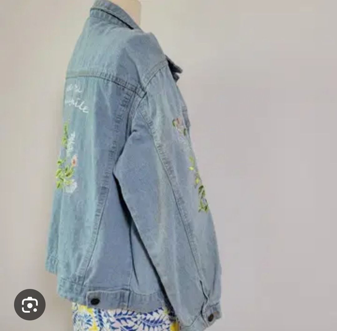 Embroidered Denim Jacket with "See You Really Smile" (Category: Coats, Jackets and Outerwear) located in Manila. Submitted by katkween23 (Listing ID 1462063627, Image 1). Description: - Light wash denim jacket - Beautiful floral embroidery on the back - Features text "see you really smile" - Classic button-up style - Two chest pockets - Ideal for layering - Unique and eye-catching piece.