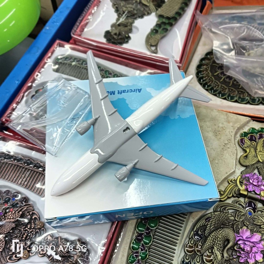 Emirates Aircraft Model Airplane Toy (Category: Vehicle & Diecast Models) located in Manila. Submitted by iliasjen3082126 (Listing ID 1462105714, Image 2). Description: - Model airplane from Emirates - Ideal for collectors and aviation enthusiasts - Comes in its original box - Features a detailed design - Perfect for display purposes.