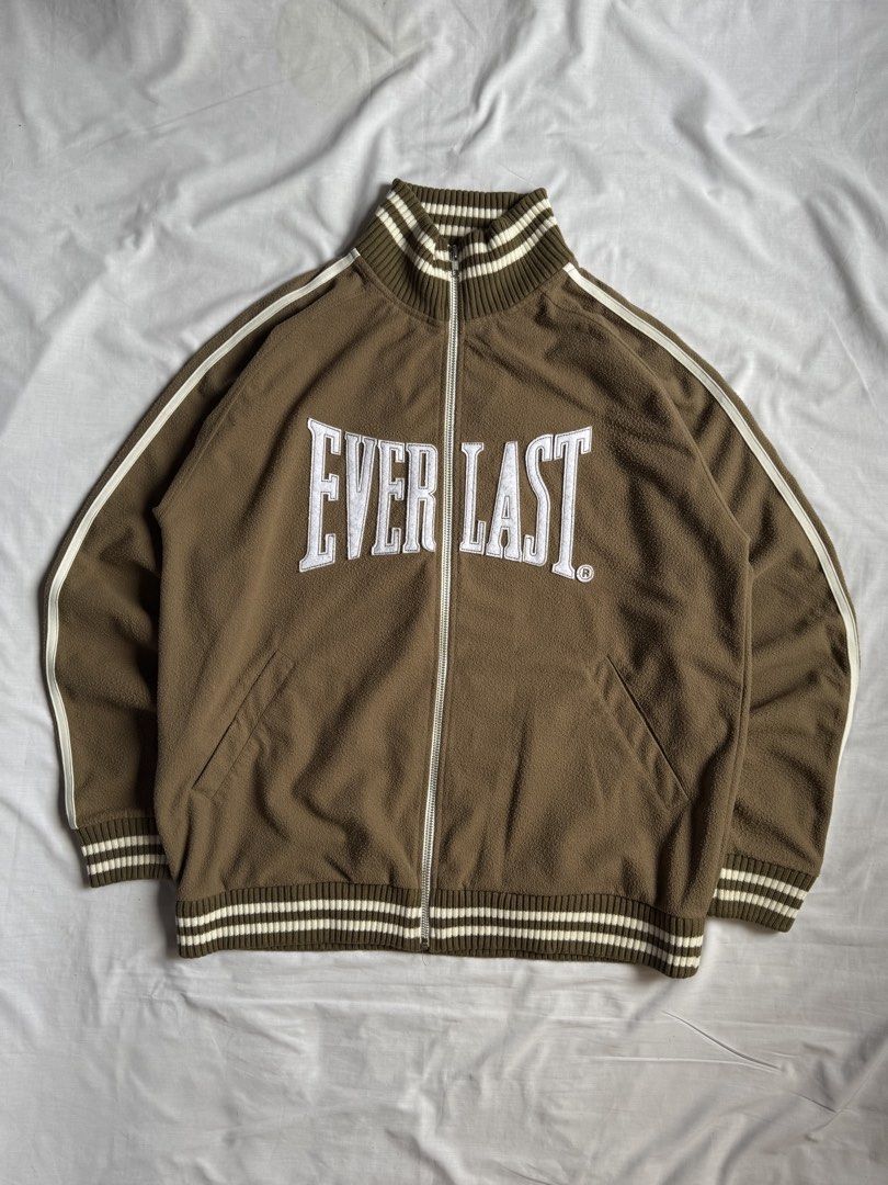 Everlast Brown Fleece Track Jacket (Category: Coats, Jackets and Outerwear) located in Binan City. Submitted by davintagefindsph (Listing ID 1462168099, Image 1). Description: Everlast Full-zip Track Jacket Excellent condition. Banger piece! ❤️‍🔥 L27” W24” - Fits L to XL Condition: 10/10 Issue/s: none Model: 5’2 - 63kg.