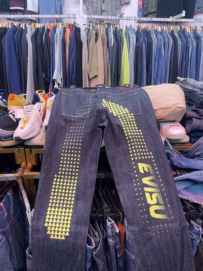 Evisu Authentic Handcrafted Denim Jeans (Category: Jeans) located in Manila. Submitted by oenthrift.2026 (Listing ID 1462082045, Image 2). Description: - Authentic Evisu dark wash jeans - Iconic Evisu logo and triangle pattern on back pockets - Handcrafted denim - Button fly closure - Straight leg fit - Ideal for everyday casual wear.