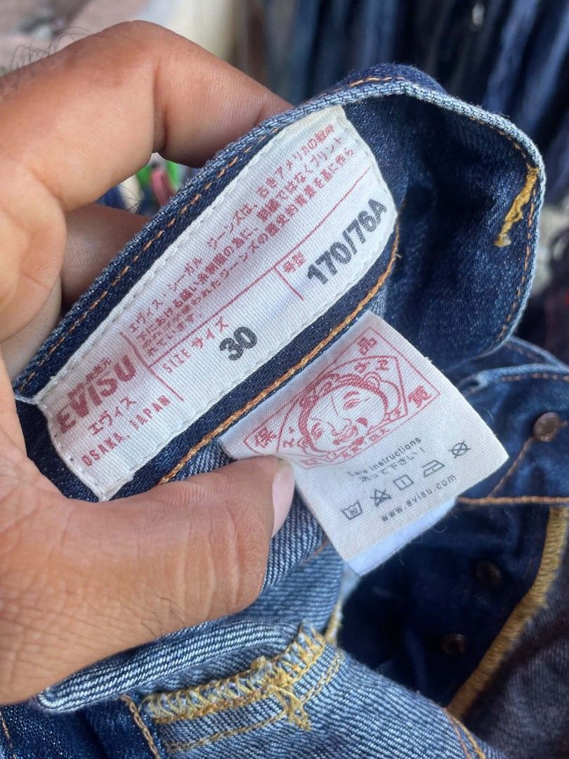 EVISU No. 2 Denim Shorts Size 30 (Category: Shorts) located in Talisay. Submitted by btchgetsome1 (Listing ID 1462073803, Image 2). Description: - Authentic Evisu denim shorts - Size 30 - Iconic Evisu seagull logo on back pockets - Unique paisley patch details (yellow, blue, pink) - Button fly closure - Made in Japan - Ideal for casual wear.